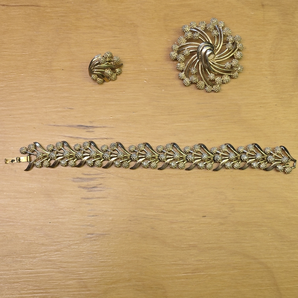 Trifari vintage gold tone brooch, bracelet, 1 clip on earring
